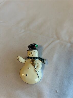 Source Unknown Ivory Snowman Brooch with Black Hat and Green Scarf